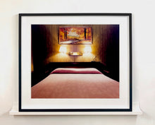 Load image into Gallery viewer, An ongoing subject of Richard's photography is the motel room. In this instance, photographed at the Lariat Motel in Fallon, Nevada. It is also often a significant location within American film and TV culture. For example, It is the backdrop for the iconic scene in the Hollywood film psycho. In this atmospheric image, the bed lights are joined together conveying a sense of coupling.
