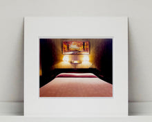 Load image into Gallery viewer, An ongoing subject of Richard's photography is the motel room. In this instance, photographed at the Lariat Motel in Fallon, Nevada. It is also often a significant location within American film and TV culture. For example, It is the backdrop for the iconic scene in the Hollywood film psycho. In this atmospheric image, the bed lights are joined together conveying a sense of coupling.
