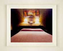 Load image into Gallery viewer, An ongoing subject of Richard's photography is the motel room. In this instance, photographed at the Lariat Motel in Fallon, Nevada. It is also often a significant location within American film and TV culture. For example, It is the backdrop for the iconic scene in the Hollywood film psycho. In this atmospheric image, the bed lights are joined together conveying a sense of coupling.