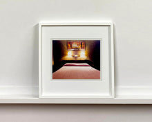 Load image into Gallery viewer, An ongoing subject of Richard's photography is the motel room. In this instance, photographed at the Lariat Motel in Fallon, Nevada. It is also often a significant location within American film and TV culture. For example, It is the backdrop for the iconic scene in the Hollywood film psycho. In this atmospheric image, the bed lights are joined together conveying a sense of coupling.