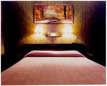Load image into Gallery viewer, An ongoing subject of Richard's photography is the motel room. In this instance, photographed at the Lariat Motel in Fallon, Nevada. It is also often a significant location within American film and TV culture. For example, It is the backdrop for the iconic scene in the Hollywood film psycho. In this atmospheric image, the bed lights are joined together conveying a sense of coupling.