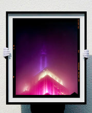 Load image into Gallery viewer, NOMAD I (Film Rebate), New York. Richard Heeps has photographed the iconic Empire State building in the mist. The NOMAD sequence of photographs capture the art deco architecture illuminated by changing colours, and is part of Richard's street photography portfolio which depict the colour, fabric and structure of cities with distinct style. This 6x7 format edition is bordered by the Kodak film rebate. 