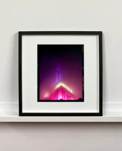Load image into Gallery viewer, NOMAD I (Film Rebate), New York. Richard Heeps has photographed the iconic Empire State building in the mist. The NOMAD sequence of photographs capture the art deco architecture illuminated by changing colours, and is part of Richard's street photography portfolio which depict the colour, fabric and structure of cities with distinct style. This 6x7 format edition is bordered by the Kodak film rebate. 
