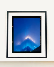 Load image into Gallery viewer, 'NOMAD II (Film Rebate)', New York. Richard Heeps has photographed the iconic Empire State building in the mist. The NOMAD sequence of photographs capture the art deco architecture illuminated by changing colours, and is part of Richard's street photography portfolio which depict the colour, fabric and structure of cities with distinct style. This 6x7 format edition is bordered by the Kodak film rebate. 