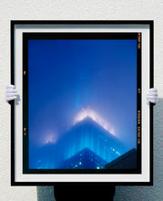 Load image into Gallery viewer, 'NOMAD II (Film Rebate)', New York. Richard Heeps has photographed the iconic Empire State building in the mist. The NOMAD sequence of photographs capture the art deco architecture illuminated by changing colours, and is part of Richard's street photography portfolio which depict the colour, fabric and structure of cities with distinct style. This 6x7 format edition is bordered by the Kodak film rebate. 