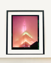 Load image into Gallery viewer, 'NOMAD III (Film Rebate)', New York. Richard Heeps has photographed the iconic Empire State building in the mist. The NOMAD sequence of photographs capture the art deco architecture illuminated by changing colours, and is part of Richard's street photography portfolio which depict the colour, fabric and structure of cities with distinct style. This 6x7 format edition is bordered by the Kodak film rebate.