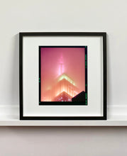 Load image into Gallery viewer, 'NOMAD III (Film Rebate)', New York. Richard Heeps has photographed the iconic Empire State building in the mist. The NOMAD sequence of photographs capture the art deco architecture illuminated by changing colours, and is part of Richard's street photography portfolio which depict the colour, fabric and structure of cities with distinct style. This 6x7 format edition is bordered by the Kodak film rebate.