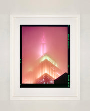 Load image into Gallery viewer, 'NOMAD III (Film Rebate)', New York. Richard Heeps has photographed the iconic Empire State building in the mist. The NOMAD sequence of photographs capture the art deco architecture illuminated by changing colours, and is part of Richard's street photography portfolio which depict the colour, fabric and structure of cities with distinct style. This 6x7 format edition is bordered by the Kodak film rebate.
