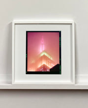 Load image into Gallery viewer, 'NOMAD III (Film Rebate)', New York. Richard Heeps has photographed the iconic Empire State building in the mist. The NOMAD sequence of photographs capture the art deco architecture illuminated by changing colours, and is part of Richard's street photography portfolio which depict the colour, fabric and structure of cities with distinct style. This 6x7 format edition is bordered by the Kodak film rebate.