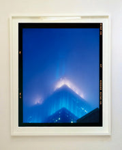 Load image into Gallery viewer, 'NOMAD II (Film Rebate)', New York. Richard Heeps has photographed the iconic Empire State building in the mist. The NOMAD sequence of photographs capture the art deco architecture illuminated by changing colours, and is part of Richard's street photography portfolio which depict the colour, fabric and structure of cities with distinct style. This 6x7 format edition is bordered by the Kodak film rebate. 