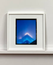 Load image into Gallery viewer, 'NOMAD II (Film Rebate)', New York. Richard Heeps has photographed the iconic Empire State building in the mist. The NOMAD sequence of photographs capture the art deco architecture illuminated by changing colours, and is part of Richard's street photography portfolio which depict the colour, fabric and structure of cities with distinct style. This 6x7 format edition is bordered by the Kodak film rebate. 