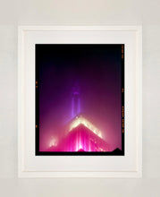 Load image into Gallery viewer, NOMAD I (Film Rebate), New York. Richard Heeps has photographed the iconic Empire State building in the mist. The NOMAD sequence of photographs capture the art deco architecture illuminated by changing colours, and is part of Richard's street photography portfolio which depict the colour, fabric and structure of cities with distinct style. This 6x7 format edition is bordered by the Kodak film rebate. 