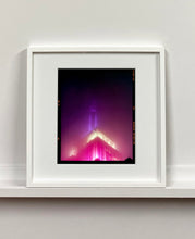 Load image into Gallery viewer, NOMAD I (Film Rebate), New York. Richard Heeps has photographed the iconic Empire State building in the mist. The NOMAD sequence of photographs capture the art deco architecture illuminated by changing colours, and is part of Richard's street photography portfolio which depict the colour, fabric and structure of cities with distinct style. This 6x7 format edition is bordered by the Kodak film rebate. 
