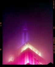 Load image into Gallery viewer, NOMAD I (Film Rebate), New York. Richard Heeps has photographed the iconic Empire State building in the mist. The NOMAD sequence of photographs capture the art deco architecture illuminated by changing colours, and is part of Richard's street photography portfolio which depict the colour, fabric and structure of cities with distinct style. This 6x7 format edition is bordered by the Kodak film rebate. 