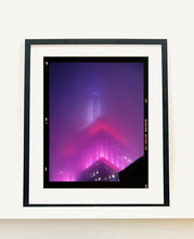 Load image into Gallery viewer, 'NOMAD V (Film Rebate)', New York. Richard Heeps has photographed the iconic Empire State building in the mist. The NOMAD sequence of photographs capture the art deco architecture illuminated by changing colours, and is part of Richard's street photography portfolio which depict the colour, fabric and structure of cities with distinct style. This 6x7 format edition is bordered by the Kodak film rebate. 