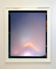 Load image into Gallery viewer, 'NOMAD VI (Film Rebate)', New York. Richard Heeps has photographed the iconic Empire State building in the mist. The NOMAD sequence of photographs capture the art deco architecture illuminated by changing colours, and is part of Richard's street photography portfolio which depict the colour, fabric and structure of cities with distinct style. This 6x7 format edition is bordered by the Kodak film rebate. 