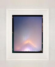 Load image into Gallery viewer, 'NOMAD VI (Film Rebate)', New York. Richard Heeps has photographed the iconic Empire State building in the mist. The NOMAD sequence of photographs capture the art deco architecture illuminated by changing colours, and is part of Richard's street photography portfolio which depict the colour, fabric and structure of cities with distinct style. This 6x7 format edition is bordered by the Kodak film rebate. 