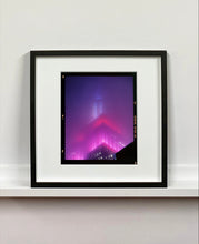 Load image into Gallery viewer, 'NOMAD V (Film Rebate)', New York. Richard Heeps has photographed the iconic Empire State building in the mist. The NOMAD sequence of photographs capture the art deco architecture illuminated by changing colours, and is part of Richard's street photography portfolio which depict the colour, fabric and structure of cities with distinct style. This 6x7 format edition is bordered by the Kodak film rebate. 