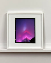 Load image into Gallery viewer, 'NOMAD V (Film Rebate)', New York. Richard Heeps has photographed the iconic Empire State building in the mist. The NOMAD sequence of photographs capture the art deco architecture illuminated by changing colours, and is part of Richard's street photography portfolio which depict the colour, fabric and structure of cities with distinct style. This 6x7 format edition is bordered by the Kodak film rebate. 