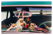 Load image into Gallery viewer, 'Oldsmobile &amp; Sinful Barbie's' photographed in, Las Vegas, Nevada, is part of Richard Heeps 'Man's Ruin' Series. This artwork makes up the three piece sequence: 'Wendy Flamin' Eyeball', 'Wendy Resting' &amp; 'Oldsmobile and Sinful Barbie's' shot at the Rockabilly Weekender, Viva Las Vegas. Here this is a brilliantly adult version of the iconic Barbie Doll on the dashboard of a classic American Car. 