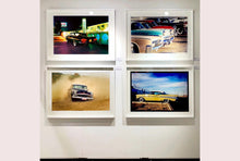 Load image into Gallery viewer, 'Donut' shows a classic American car donut driving on a Norfolk beach in the East of England. This photograph was captured at Hemsby Rock and Roll weekend, and is part of Richard Heeps' Man's Ruin' series.