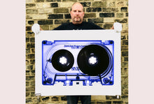 Load image into Gallery viewer, Tape Collection 'Blue Tinted Cassette'. The Heidler &amp; Heeps collaborations are creative representations of Natasha Heidler and Richard Heeps’ personal past, and their personalities. Tapes are significant in both their lives and the work here is made from their own collections. Their unique process makes these artworks not inanimate objects, rather they have depth, texture, grit, and they even appear to move.