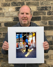 Load image into Gallery viewer, 'Boutique' is street portrait, taken in Palm Springs, California. This piece is different from Richard Heeps' usual style, but everything fell into place: the light, the colours, and the man walking through the shot.
