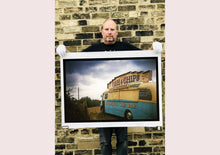 Load image into Gallery viewer, A moody Fenland sky is backdrop to a classic British Fish &amp; Chips Van. The typography and the van itself has a fun fairground feel, contrary to the muted tones of this piece. Part of Richard Heeps series, 'A View of the Fens from the Car with Wings'.