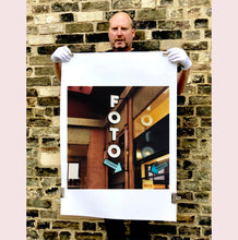 Load image into Gallery viewer, A vintage neon sign outside of a Foto Studio in Milan.