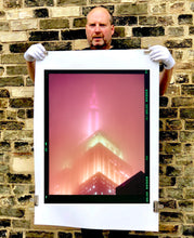 Load image into Gallery viewer, 'NOMAD III (Film Rebate)', New York. Richard Heeps has photographed the iconic Empire State building in the mist. The NOMAD sequence of photographs capture the art deco architecture illuminated by changing colours, and is part of Richard's street photography portfolio which depict the colour, fabric and structure of cities with distinct style. This 6x7 format edition is bordered by the Kodak film rebate.