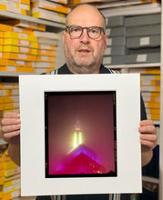 Load image into Gallery viewer, NOMAD VII (Film Rebate), New York, photography by Richard Heeps capturing the iconic Empire State building in the mist. Part of a sequence of photographs capturing the art deco architecture illuminated in changing colours. This 6x7 format edition is bordered by the Kodak film rebate. This artwork is part of Richard's portfolio of street photography he is building up which depict the colour, fabric and structure of cities with distinct style