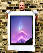 Load image into Gallery viewer, 'NOMAD VIII (Film Rebate)', New York. Richard Heeps has photographed the iconic Empire State building in the mist. The NOMAD sequence of photographs capture the art deco architecture illuminated by changing colours, and is part of Richard's street photography portfolio which depict the colour, fabric and structure of cities with distinct style. This 6x7 format edition is bordered by the Kodak film rebate. 