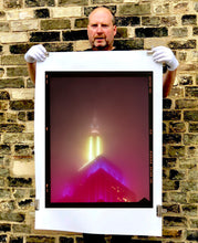 Load image into Gallery viewer, NOMAD VII (Film Rebate), New York, photography by Richard Heeps capturing the iconic Empire State building in the mist. Part of a sequence of photographs capturing the art deco architecture illuminated in changing colours. This 6x7 format edition is bordered by the Kodak film rebate. This artwork is part of Richard's portfolio of street photography he is building up which depict the colour, fabric and structure of cities with distinct style