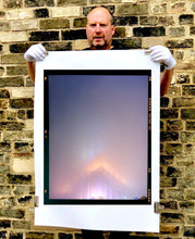 Load image into Gallery viewer, 'NOMAD VI (Film Rebate)', New York. Richard Heeps has photographed the iconic Empire State building in the mist. The NOMAD sequence of photographs capture the art deco architecture illuminated by changing colours, and is part of Richard's street photography portfolio which depict the colour, fabric and structure of cities with distinct style. This 6x7 format edition is bordered by the Kodak film rebate. 