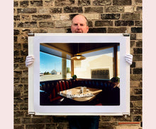 Load image into Gallery viewer, 'Nicely's Cafe' taken in Mono Lake, California, is a cinematic and classic American Diner scene photographed by Richard Heeps for his 'Dream in Colour' series. "I was driving between Death Valley and Fallon when I stopped at this Diner for a coffee. The light was perfect."