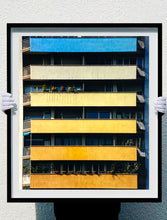 Load image into Gallery viewer, 'Rainbow Apartments' captures Italian design and architecture, showing a multi-coloured nineteen-sixties block of flats. This artwork is part of Richard Heeps' series 'A Short History of Milan' which began in November 2018 for a special project featuring at the Affordable Art Fair Milan 2019, and the series is ongoing. There is a reoccurring linear, structural theme throughout the series, capturing the Milanese use of materials in design such as glass, metal, wood and stone. 