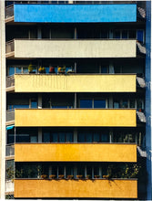 Load image into Gallery viewer, 'Rainbow Apartments' captures Italian design and architecture, showing a multi-coloured nineteen-sixties block of flats. This artwork is part of Richard Heeps' series 'A Short History of Milan' which began in November 2018 for a special project featuring at the Affordable Art Fair Milan 2019, and the series is ongoing. There is a reoccurring linear, structural theme throughout the series, capturing the Milanese use of materials in design such as glass, metal, wood and stone. 
