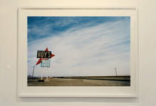 Load image into Gallery viewer, Part of the 'Dream in Colour' series, 'Roy's - Route 66' is one of Richard Heeps' classic American sign artworks featuring the road sign for Roy's Motel, which demonstrates historic Mid-Century Modern Googie architecture. This photograph was capture on the National Trails Highway of U.S. Route 66, in the Mojave Desert town of Amboy in San Bernardino County, California.