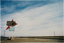 Load image into Gallery viewer, Part of the 'Dream in Colour' series, 'Roy's - Route 66' is one of Richard Heeps' classic American sign artworks featuring the road sign for Roy's Motel, which demonstrates historic Mid-Century Modern Googie architecture. This photograph was capture on the National Trails Highway of U.S. Route 66, in the Mojave Desert town of Amboy in San Bernardino County, California.