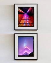 Load image into Gallery viewer, 'NOMAD VIII (Film Rebate)', New York. Richard Heeps has photographed the iconic Empire State building in the mist. The NOMAD sequence of photographs capture the art deco architecture illuminated by changing colours, and is part of Richard's street photography portfolio which depict the colour, fabric and structure of cities with distinct style. This 6x7 format edition is bordered by the Kodak film rebate. 