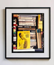 Load image into Gallery viewer, ‘Scientific Sexology’ sits amongst a stack of books, captured in Milan, Italy. 