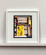 Load image into Gallery viewer, ‘Scientific Sexology’ sits amongst a stack of books, captured in Milan, Italy. 