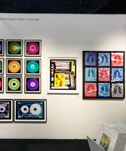 Load image into Gallery viewer, ‘Scientific Sexology’ sits amongst a stack of books, captured in Milan, Italy. 