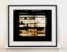 Load image into Gallery viewer, Silhouettes seen through a shop window in Milan. 
