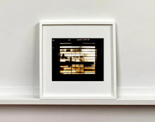 Load image into Gallery viewer, Silhouettes seen through a shop window in Milan. 