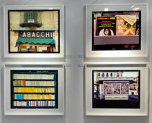 Load image into Gallery viewer, As part of Richard Heeps' series, A Short History of Milan, The Last Kiss features a series of yellow, blue and pink Italian books.