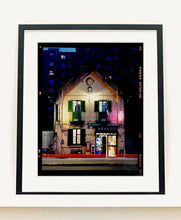 Load image into Gallery viewer, The traditional Italian Tobacconist shop, here in a Swiss Cottage style building set against a vast urban apartment block.