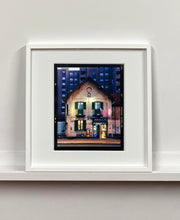 Load image into Gallery viewer, The traditional Italian Tobacconist shop, here in a Swiss Cottage style building set against a vast urban apartment block. 