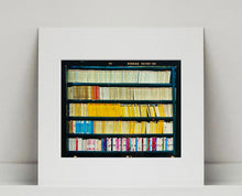 Load image into Gallery viewer, As part of Richard Heeps' series, A Short History of Milan, The Last Kiss features a series of yellow, blue and pink Italian books.