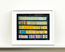 Load image into Gallery viewer, As part of Richard Heeps' series, A Short History of Milan, The Last Kiss features a series of yellow, blue and pink Italian books.
